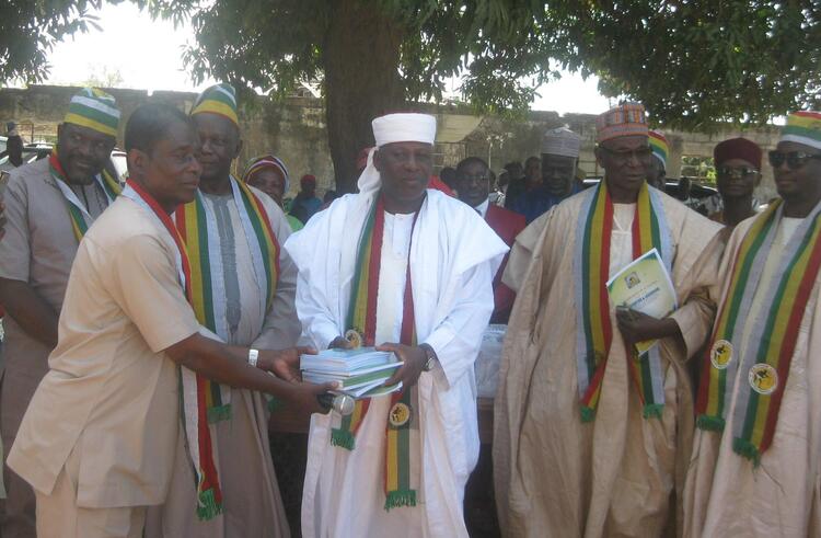 Handing over reading and writing book to Pyam community
